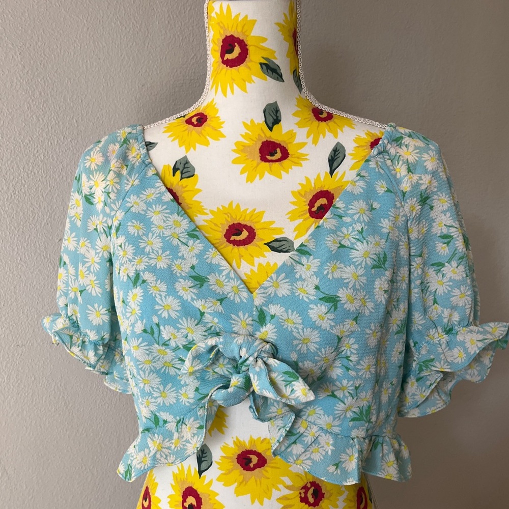 NWT BCBGeneration Blue floral top with tie front